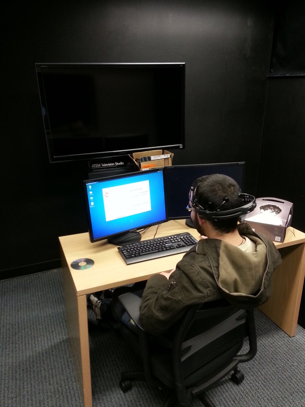 Lab mate testing the Emotiv EPOC+ EEG headset in the finished room